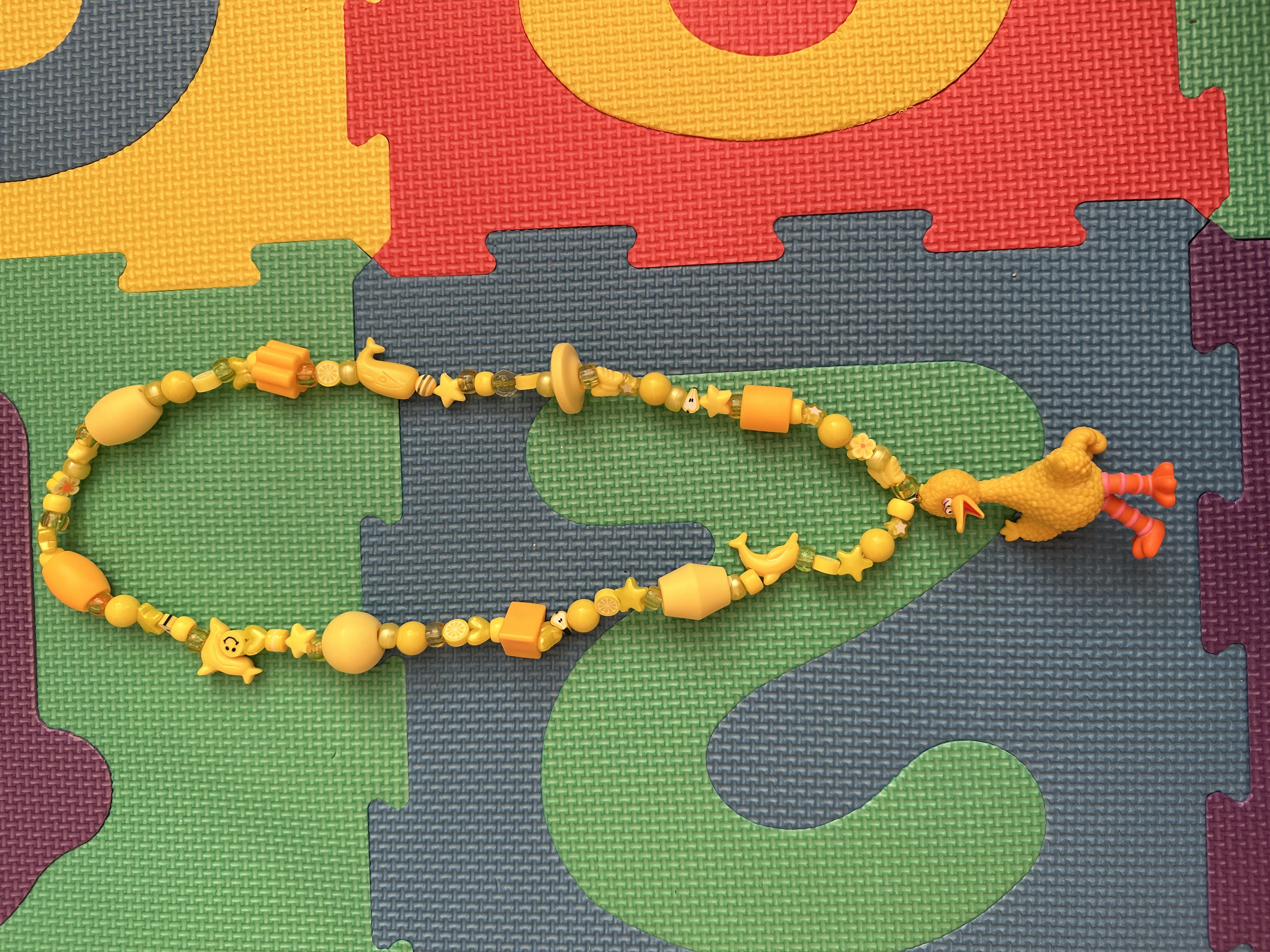 Yellow Figurine Necklace